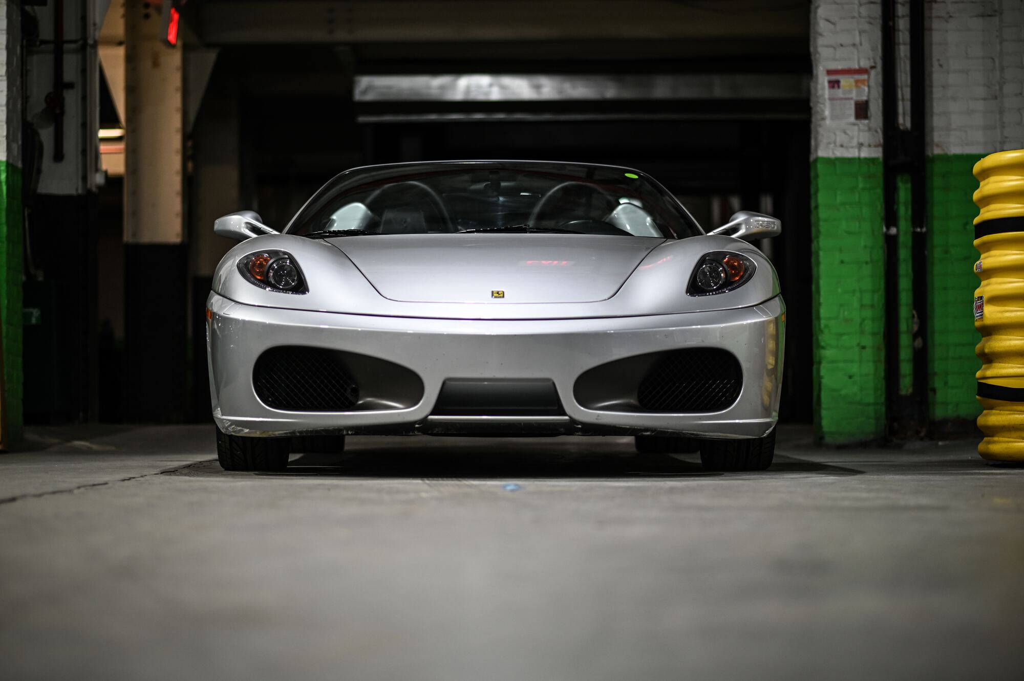 A silver Ferrari F430 in the Black Horse Garage service bay in Bridgeport, Connecticut